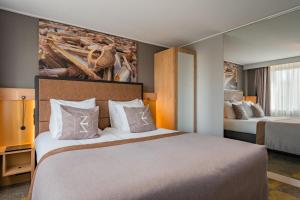 Postel nebo postele na pokoji v ubytování Hotel Zeezicht
