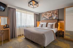 Giường trong phòng chung tại Hotel Zeezicht