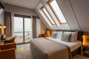 Postel nebo postele na pokoji v ubytování Hotel Zeezicht