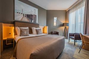 Postel nebo postele na pokoji v ubytování Hotel Zeezicht