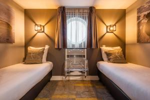 Postel nebo postele na pokoji v ubytování Hotel Zeezicht