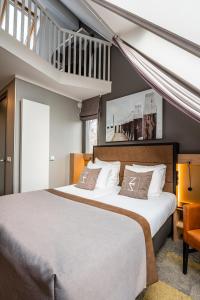 Postel nebo postele na pokoji v ubytování Hotel Zeezicht