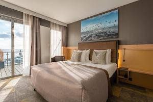 Postel nebo postele na pokoji v ubytování Hotel Zeezicht