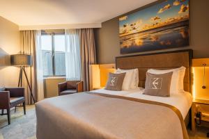 Postel nebo postele na pokoji v ubytování Hotel Zeezicht