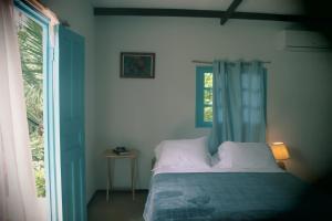 Säng eller sängar i ett rum på Casa Maya