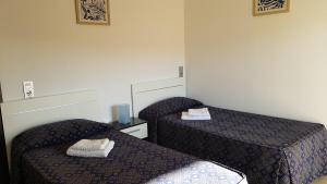 Кровать или кровати в номере Apartamentos Cala Azul La Móra