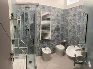 a bathroom with a shower and a toilet and a sink at Palermo City Room in Palermo +50 photos