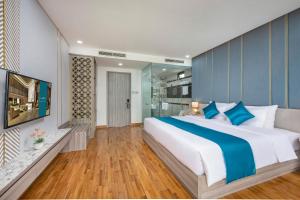Letto o letti in una camera di Calix Hotel Da Nang Beach