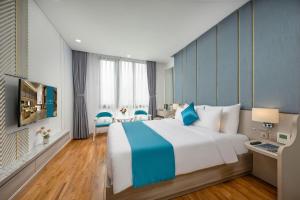 Letto o letti in una camera di Calix Hotel Da Nang Beach