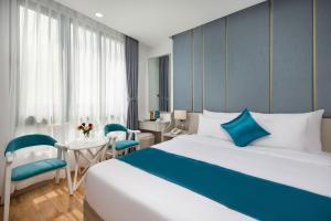 Letto o letti in una camera di Calix Hotel Da Nang Beach