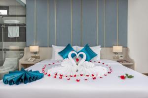 Letto o letti in una camera di Calix Hotel Da Nang Beach