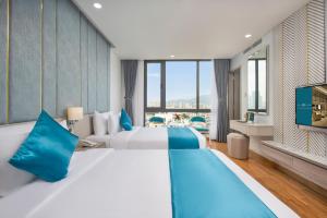 Letto o letti in una camera di Calix Hotel Da Nang Beach