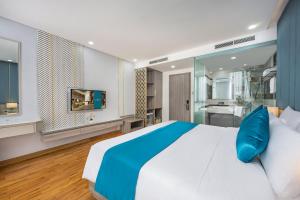 Letto o letti in una camera di Calix Hotel Da Nang Beach