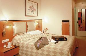 Postel nebo postele na pokoji v ubytování Hotel am Rathaus