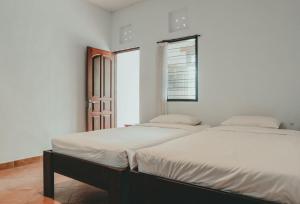 Voodi või voodid majutusasutuse Sekar Arum Riverside Resort in Canggu toas