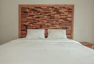 Voodi või voodid majutusasutuse Sekar Arum Riverside Resort in Canggu toas