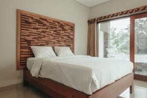 Voodi või voodid majutusasutuse Sekar Arum Riverside Resort in Canggu toas