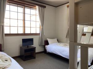 Ένα ή περισσότερα κρεβάτια σε δωμάτιο στο Murmeln