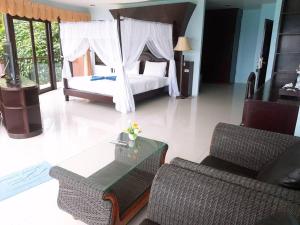 Postel nebo postele na pokoji v ubytování Koh Tao Regal Resort - SHA Plus