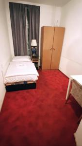 Ein Bett oder Betten in einem Zimmer der Unterkunft Märkischer Hof Hotel