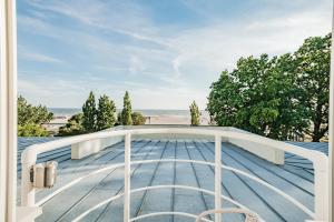 a view of the ocean from the deck of a house at Rannahotell in Pärnu