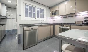 a kitchen with a sink and a dishwasher at R114 Apartment Ca La Laura in Calafell