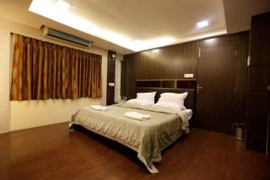 Postel nebo postele na pokoji v ubytování Hotel Metro Palace Bandra + 21 fotografií
