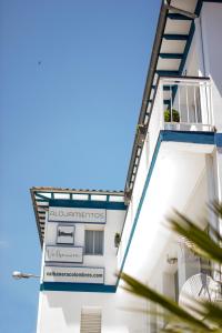 a building with a sign on the side of it at Valbanera in Colombres