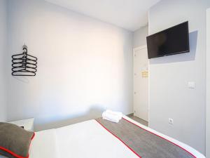 TV a/nebo společenská místnost v ubytování Hostal Jireh
