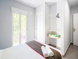 Postel nebo postele na pokoji v ubytování Hostal Jireh
