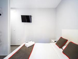 Postel nebo postele na pokoji v ubytování Hostal Jireh