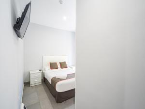 TV a/nebo společenská místnost v ubytování Hostal Jireh