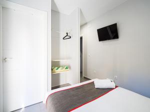 Postel nebo postele na pokoji v ubytování Hostal Jireh