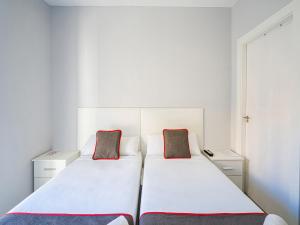 Postel nebo postele na pokoji v ubytování Hostal Jireh