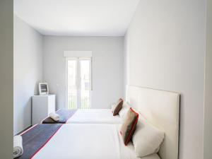 Postel nebo postele na pokoji v ubytování Hostal Jireh