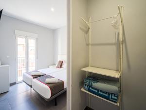 Postel nebo postele na pokoji v ubytování Hostal Jireh