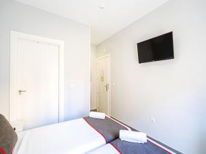TV a/nebo společenská místnost v ubytování Hostal Jireh