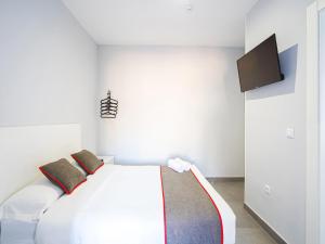 TV a/nebo společenská místnost v ubytování Hostal Jireh