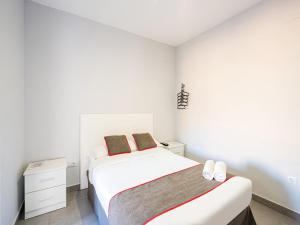 Postel nebo postele na pokoji v ubytování Hostal Jireh