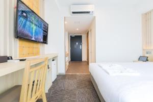 Rúm í herbergi á Henn na Hotel Premier Kyoto Eki Hachijoguchimae