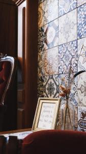 a room with a wall with blue and white tiles at B&B Willem II in Roermond