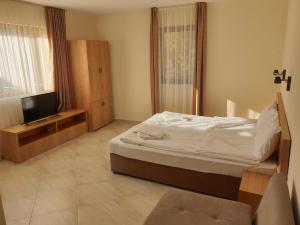 En eller flere senge i et værelse på хотел Чифлика - комплекс Чифлика
