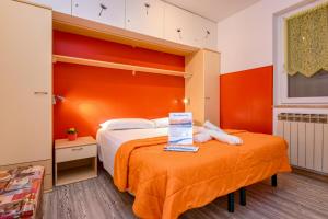Cama ou camas em um quarto em La Portella - Gardagate