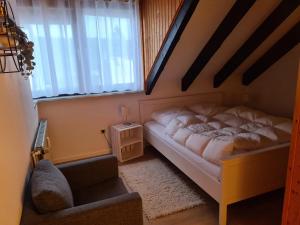 En eller flere senge i et værelse på Ferienwohnungen Dora und Hansi