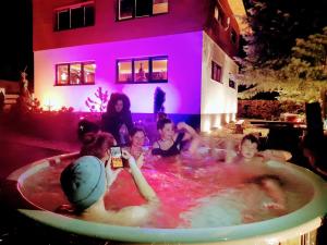 a group of people in a jacuzzi tub at Ostravice Apartment in Ostravice