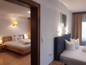 Posteľ alebo postele v izbe v ubytovaní Landhaus Klausnerhof Hotel Garni