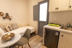 A kitchen or kitchenette at Naxos Enjoy Apartments