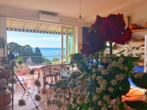 a room with a table with a view of the ocean at Stars Home in Tropea