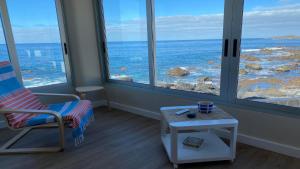 a room with a chair and a view of the ocean at Casa Camilo I in Valle Gran Rey