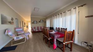 a dining room with a table and chairs and a window at Casa Camilo I in Valle Gran Rey